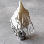 picture of stiff peaks meringue in a whisk attachment