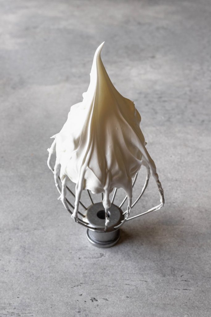 picture of stiff peaks meringue in a whisk attachment