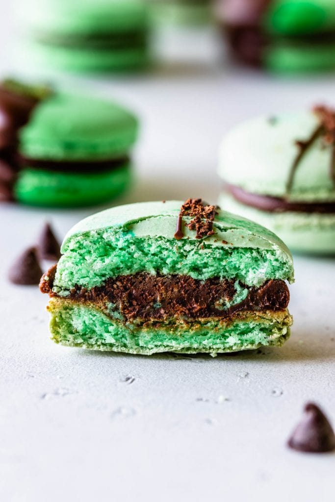 Mint Chocolate Macarons dipped in chocolate filled with ganache cut in half