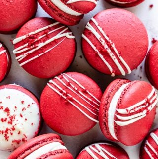 Red Velvet Macarons drizzled with white chocolate topped with red velvet cake crumbs