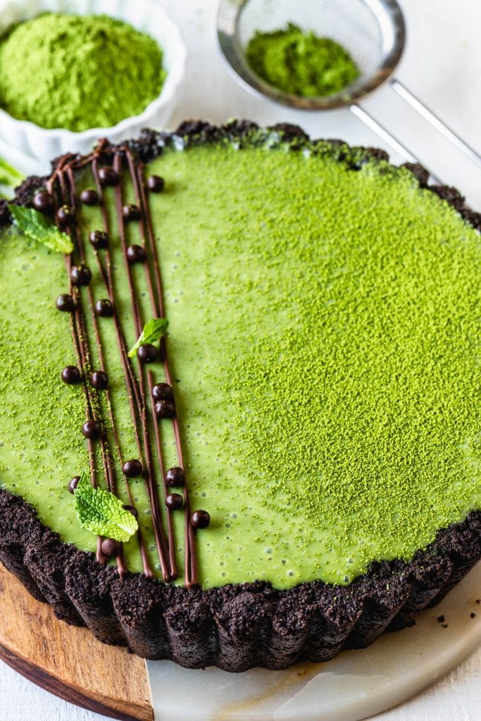 Matcha Pie with oreo crust and drizzled with chocolate and callebaut crispearls