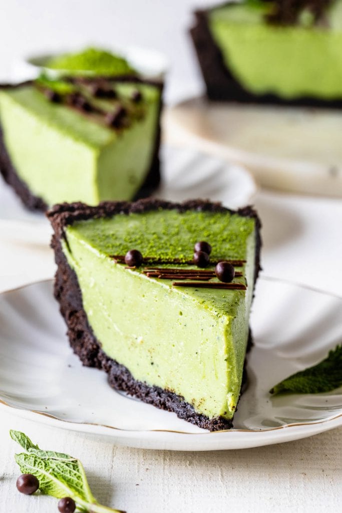 slice of Matcha Pie with oreo crust and drizzled with chocolate and callebaut crispearls