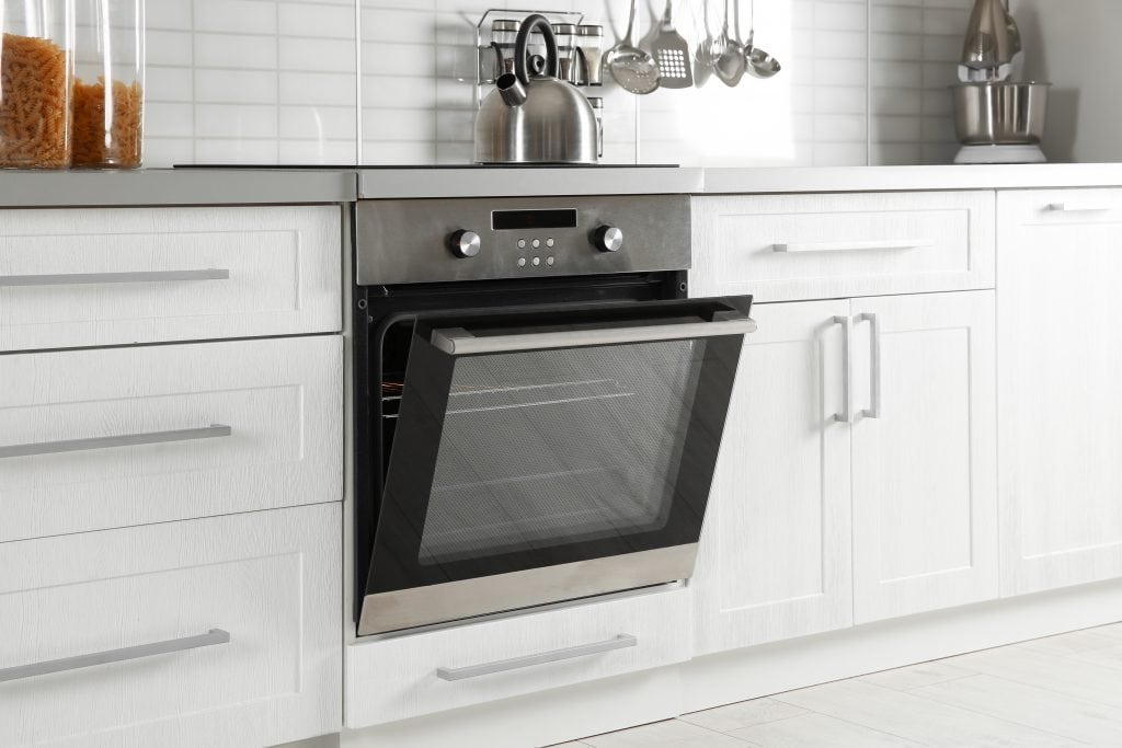 picture of an oven with a door half open