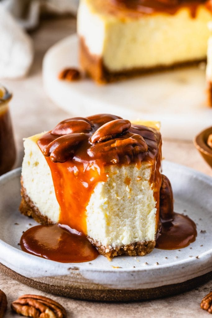 pecan cheesecake slice, topped with caramel.