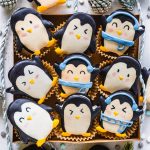 Penguin Macarons in a cookie box.