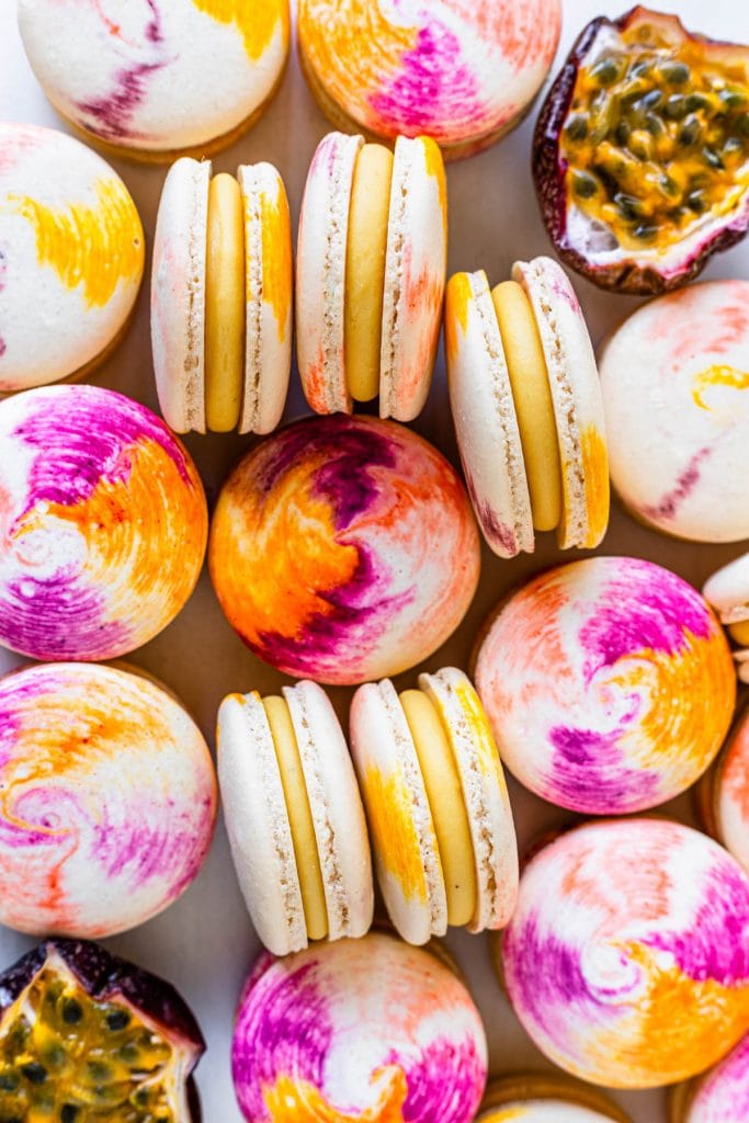 Passionfruit Macarons with Passionfruit Ganache and tie dye shells.