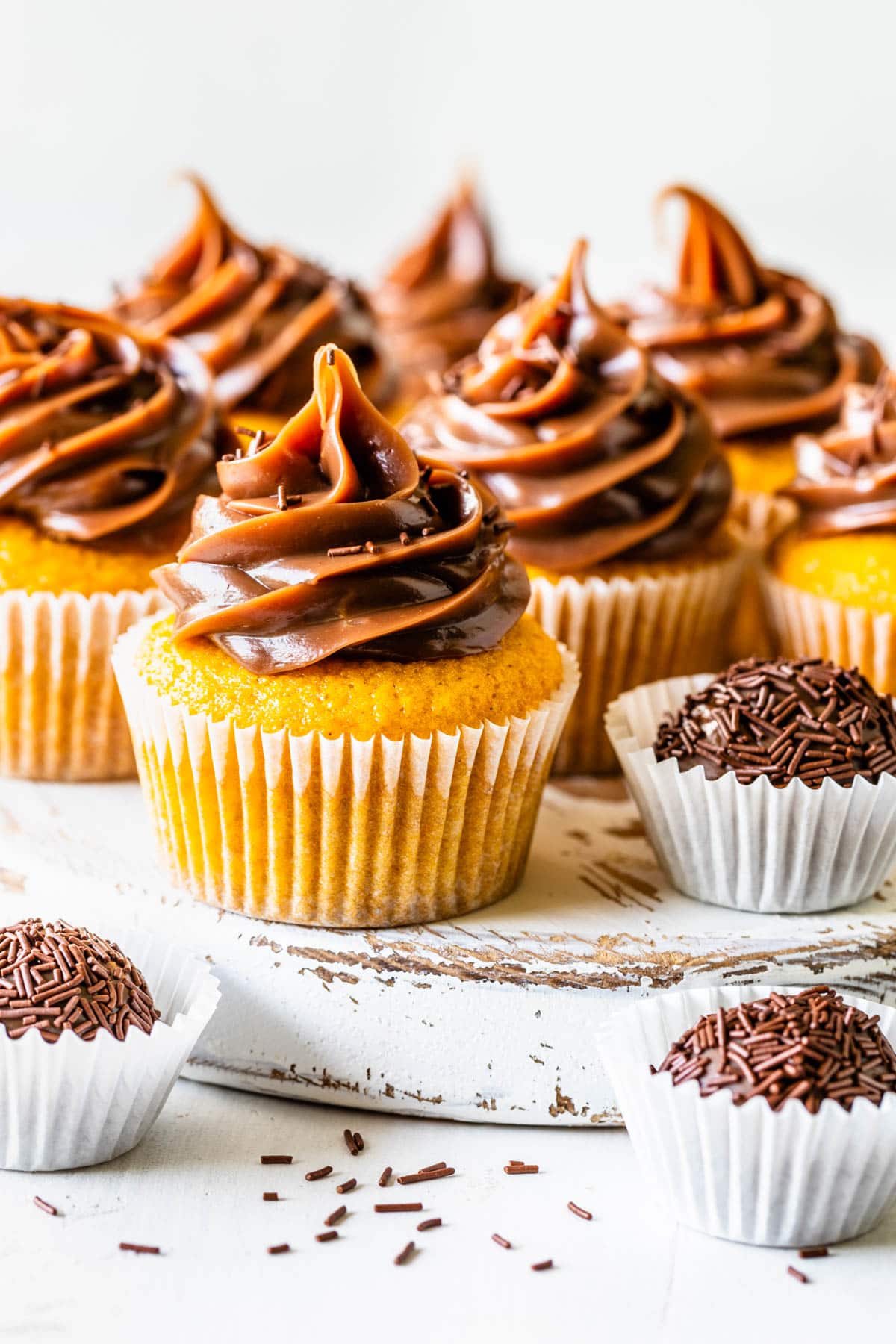 Carrot cupcakes topped with brigadeiro.