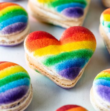 pride macarons, heart and circle shaped macarons with a rainbow decoration.