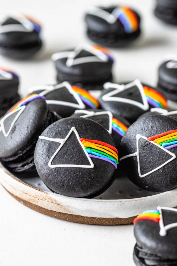 Pink Floyd Macarons, black macarons with the pink floyd logo drawn on top with royal icing.