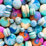 colorful macarons, pink, blue, teal, yellow.