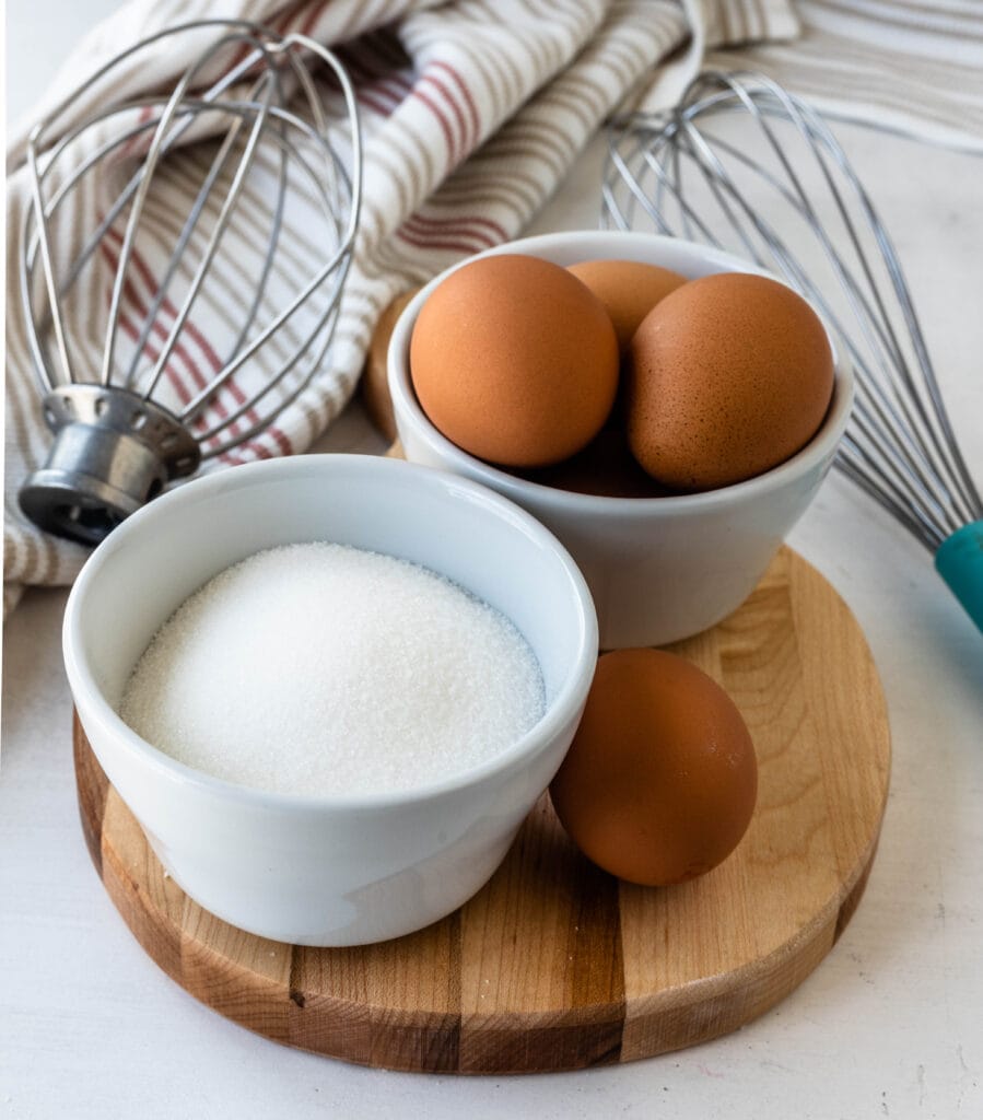eggs and sugar in bowls.