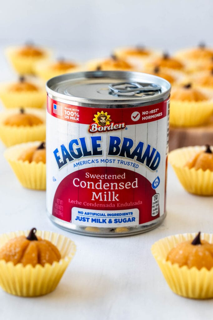 can of eagle brand sweetened condensed milk with pumpkin brigadeiros.