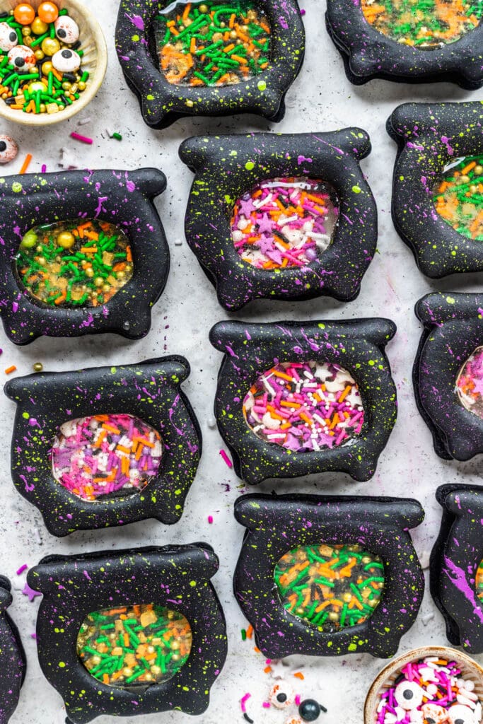 Cauldron Macarons filled with sprinkles.