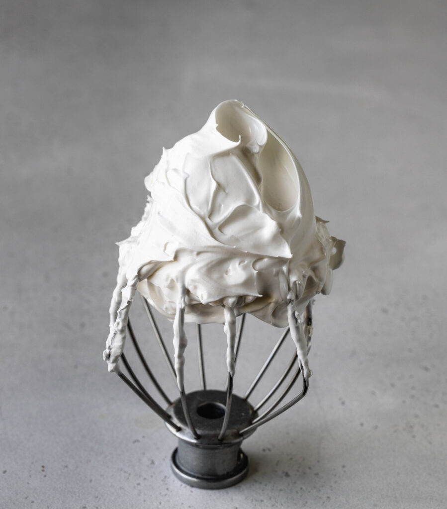 over whipped meringue on a whisk.