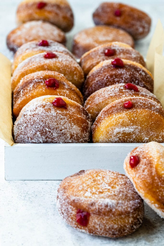 Sweetened Condensed Milk Donuts filled with raspberry jelly.