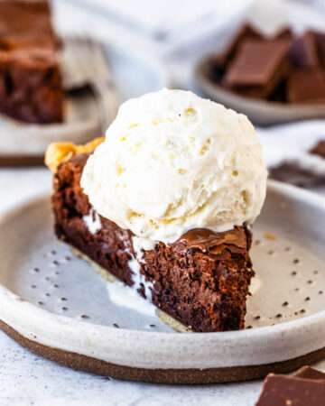 brownie pie slice with ice cream on top.