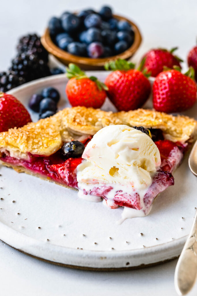 Mixed Berry Galette slice with ice cream on top.
