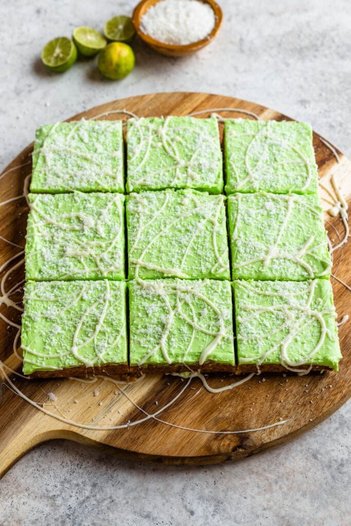 coconut bars topped with a green frosting.