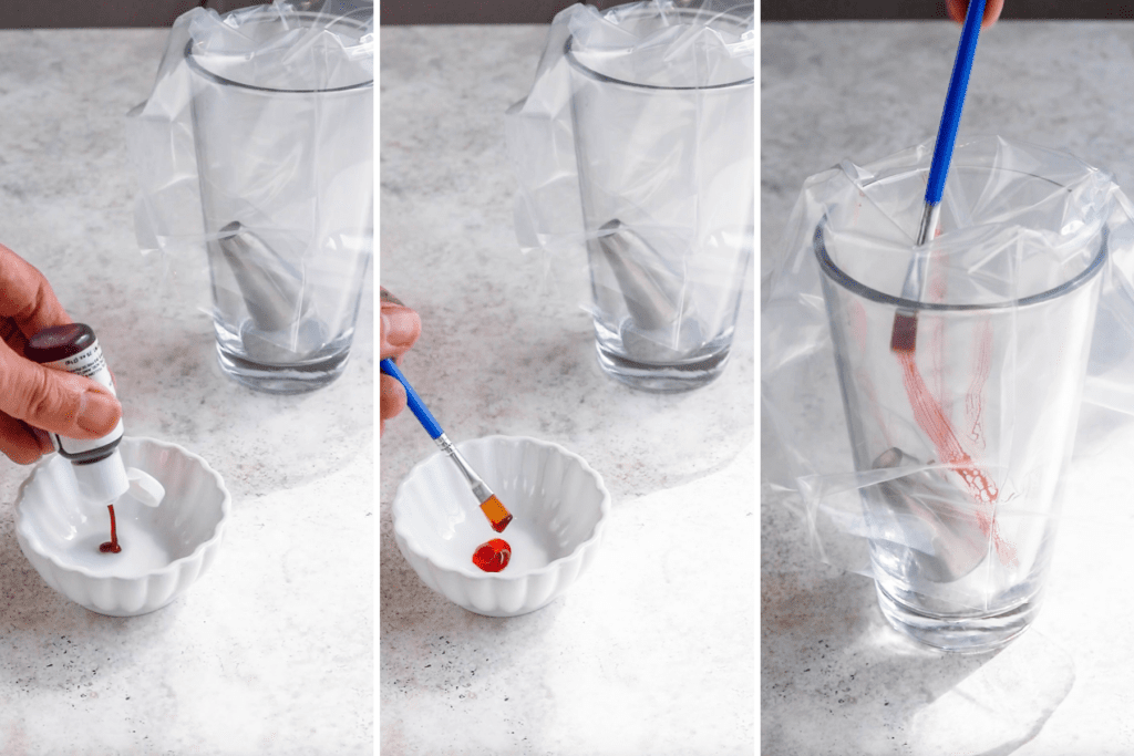 painting the sides of piping bag with orange food coloring.