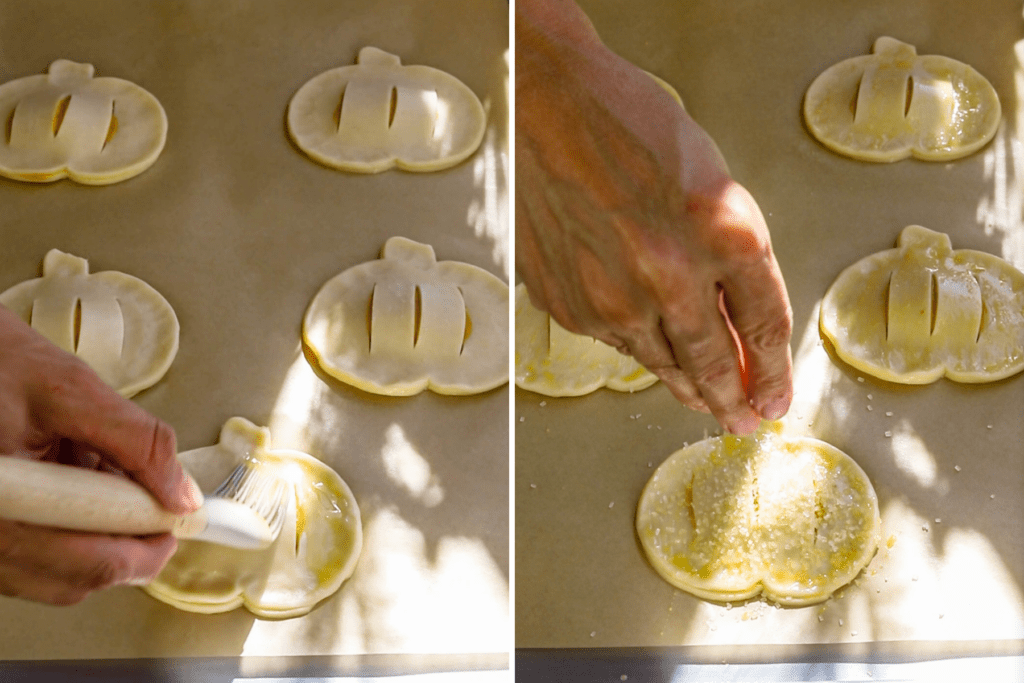 brushing top of the pastries with egg and topping with sugar.