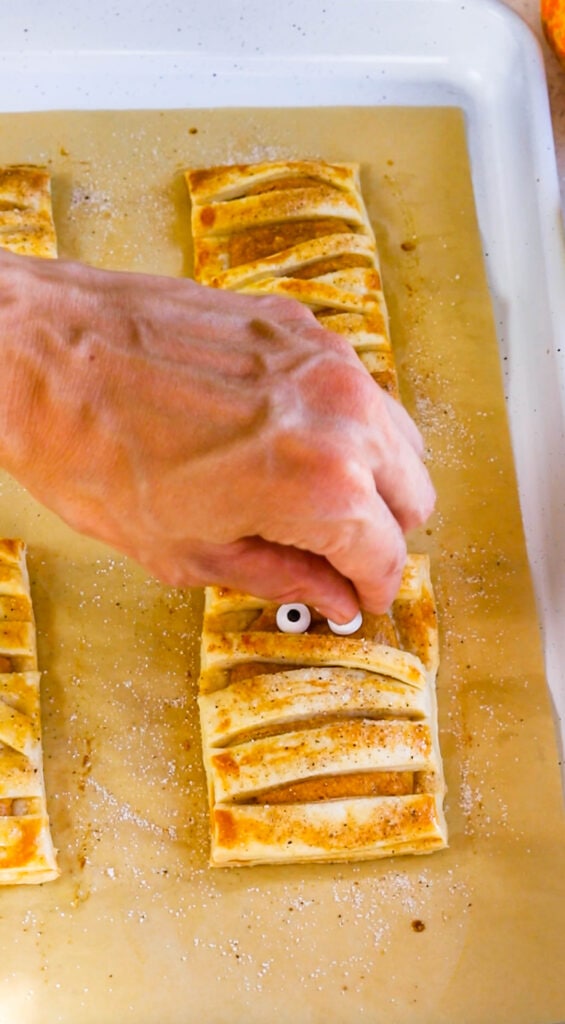 placing eyes in mummy pastry.