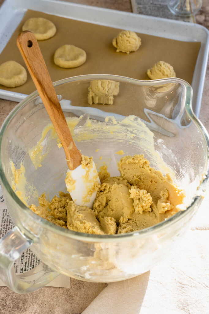 sugar cookie dough in a bowl with a spatula.