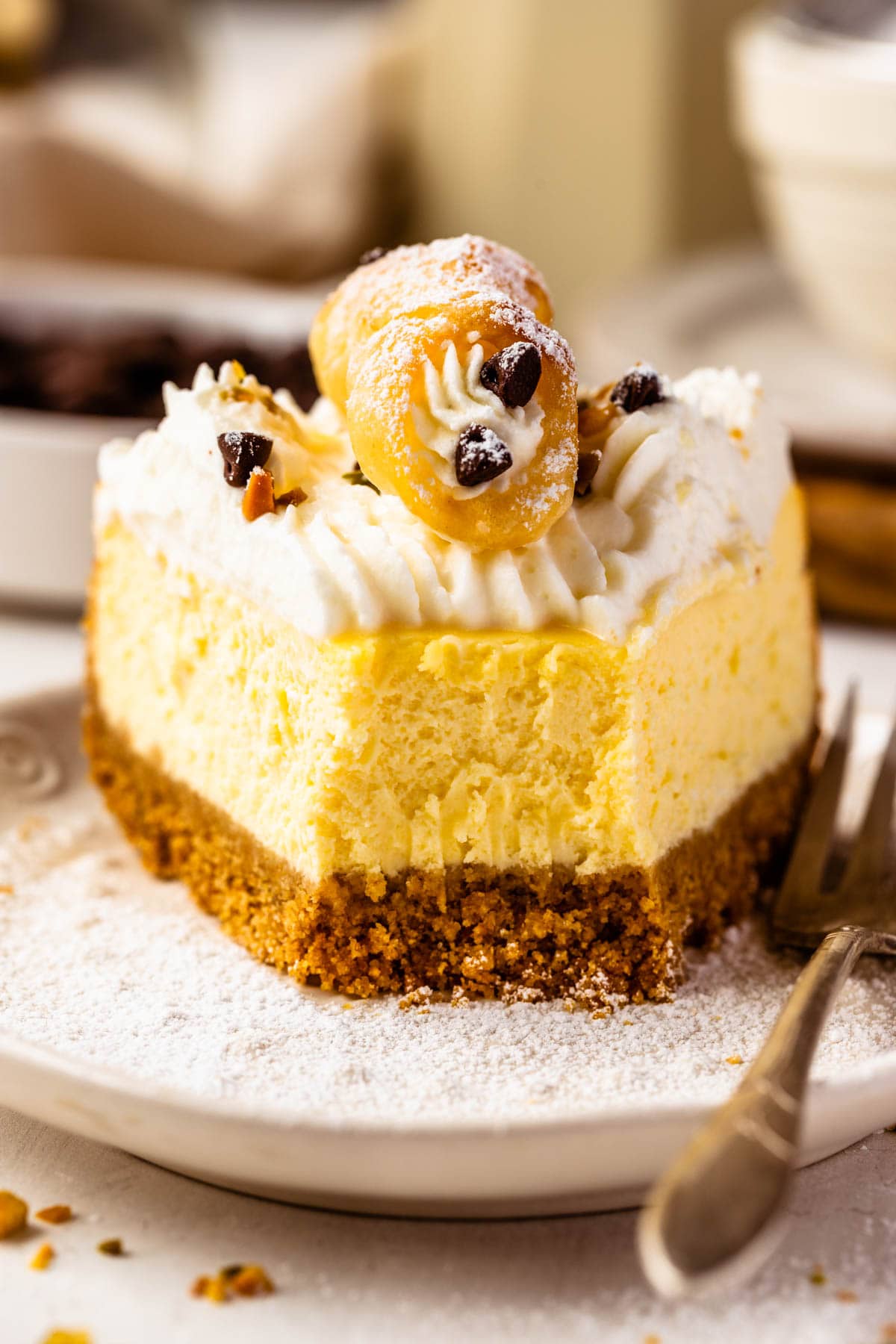 slice of cheesecake with a bite taken out of it.