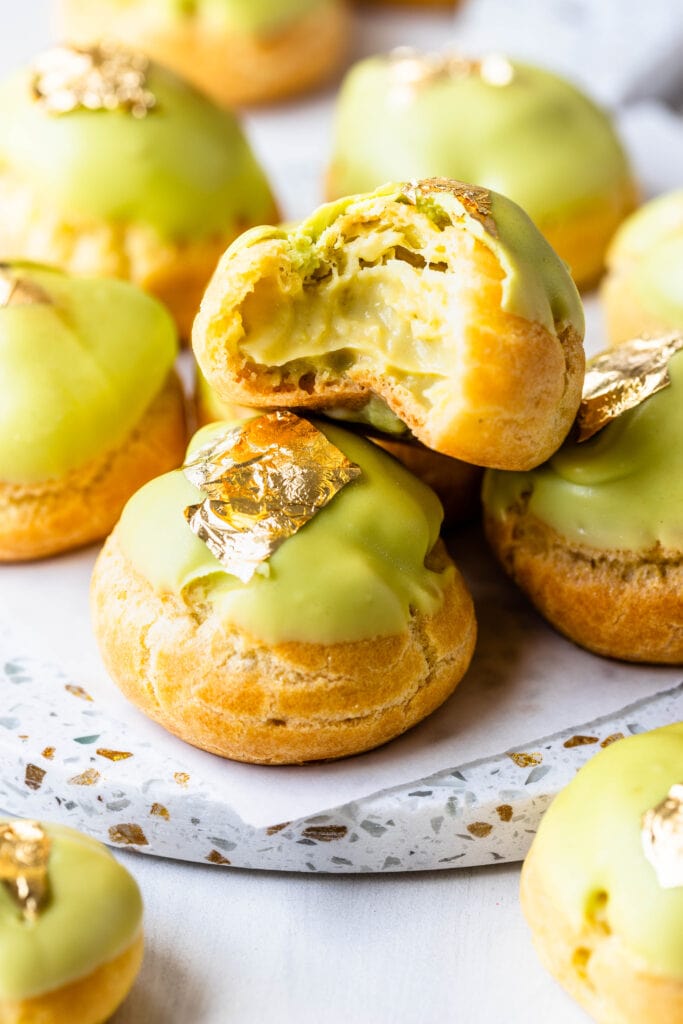 choux pastry dipped in green white chocolate.
