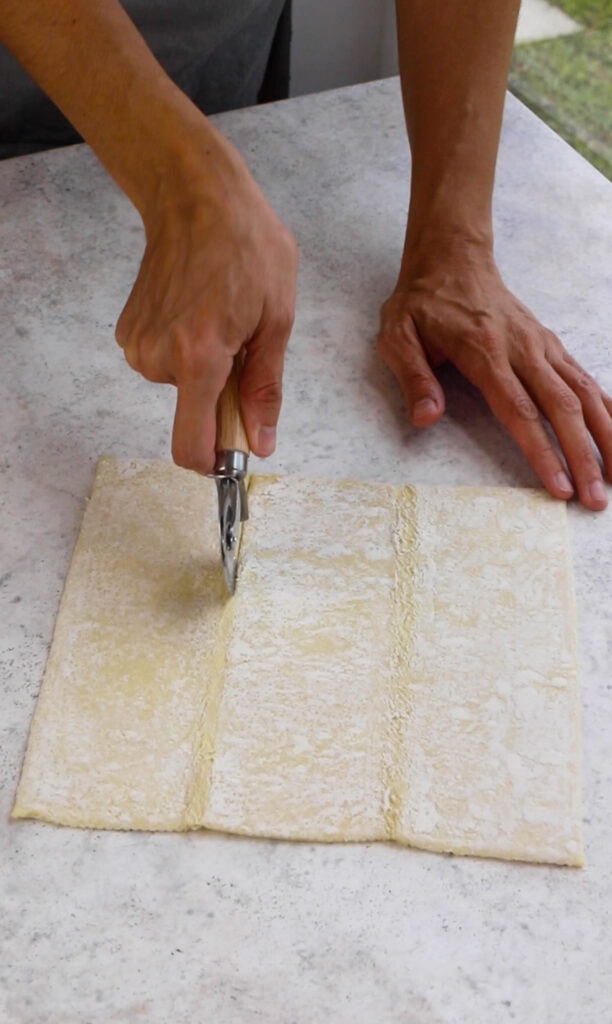 cutting out dough with a roller.