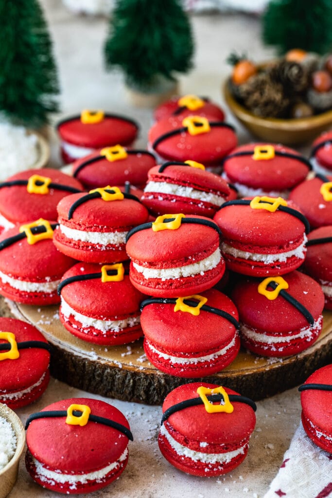 red macarons with a buckle decoration to make them look like santas.