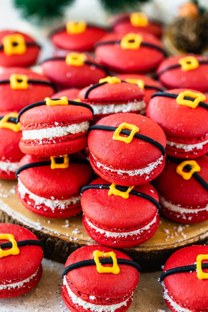 red macarons with a buckle decoration to make them look like santas.