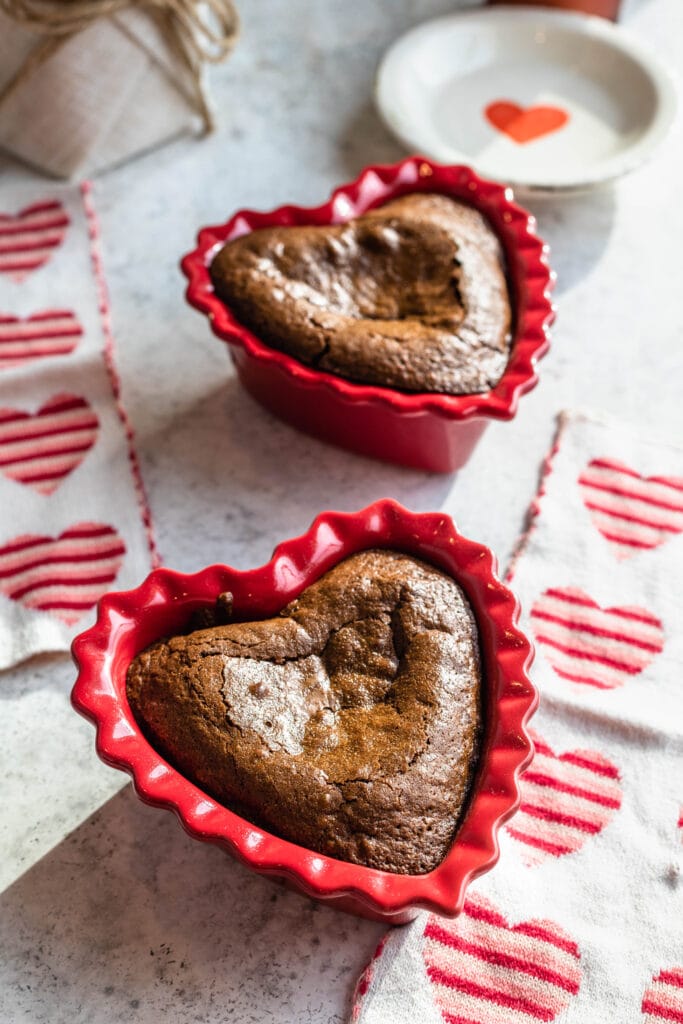 chocolate lava cakes in heart shaped ramekins.