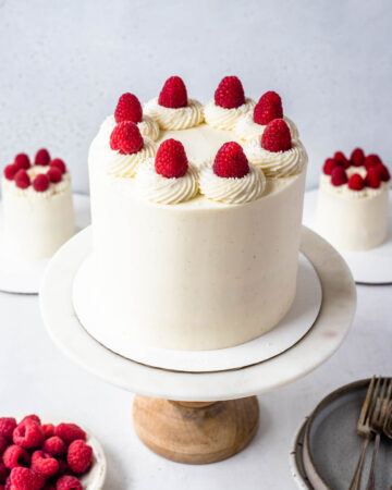raspberry cake topped with raspberries.