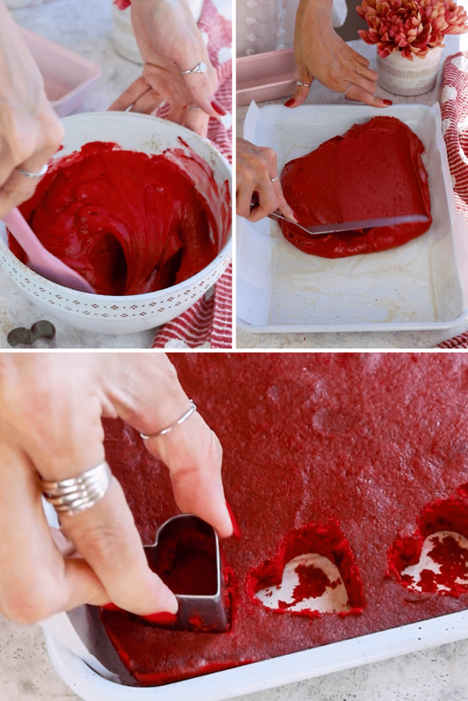 cutting a red velvet cake with a heart cookie cutter.