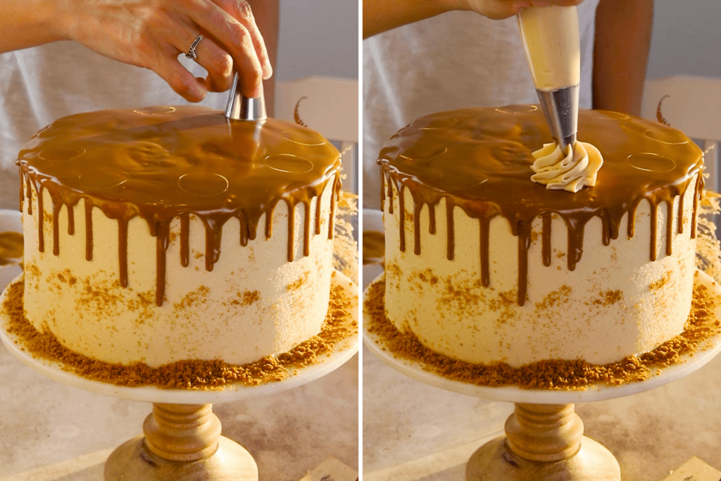 piping biscoff frosting on top of the cake.