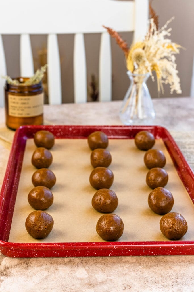 biscoff cookie truffles on a baking sheet tray.