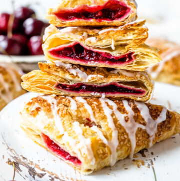 cherry turnovers sliced in half and stacked on top of each other