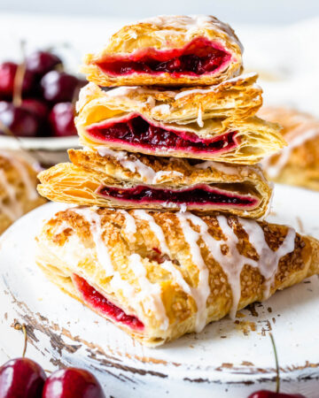 cherry turnovers sliced in half and stacked on top of each other