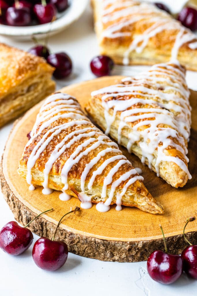 cherry turnovers topped with a sweet glaze.