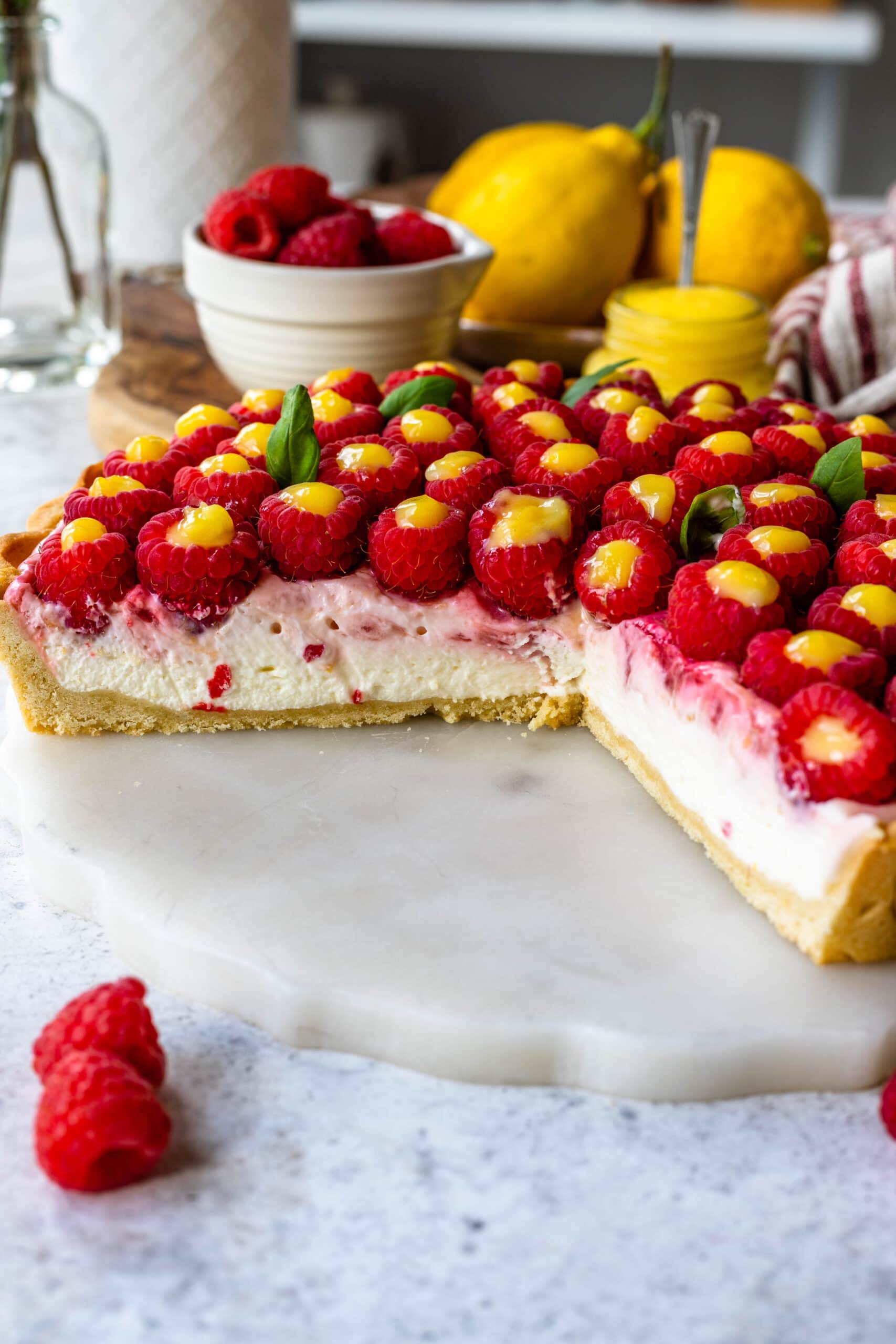 lemon raspberry cheesecake pie sliced.