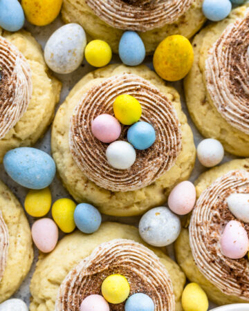 sugar cookies topped with cadbury egg frosting and cadbury eggs.