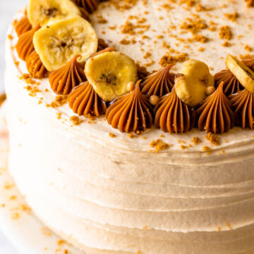 banoffee cake with dulce de leche cream cheese frosting, topped with dulce de leche and bananas.