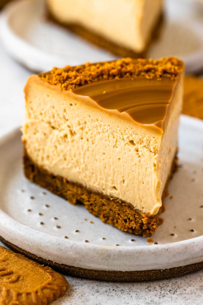 slice of biscoff cheesecake on a plate.
