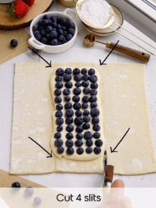 cutting 4 slits on the blueberry pastry to assemble it.