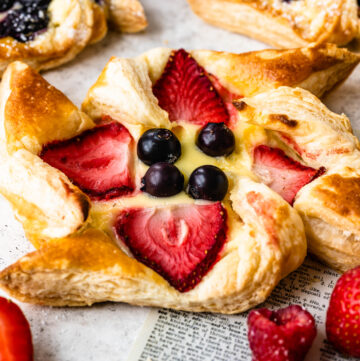 pinwheel pastry with berries in the center.