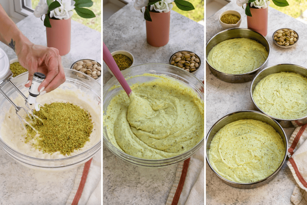 making pistachio cake batter, adding ground pistachios to the batter and mixing, then dividing the batter between 3 cake pans.