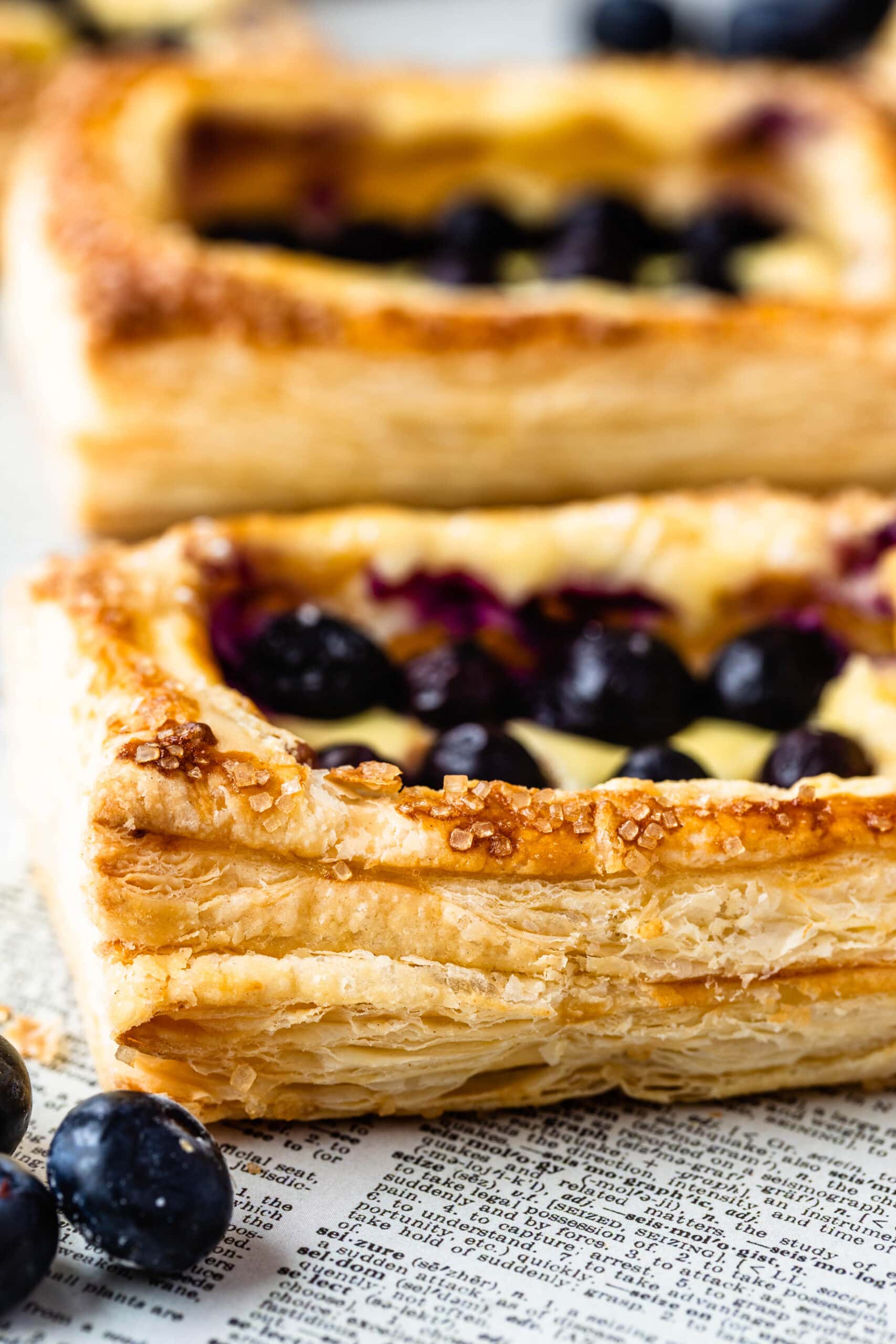 blueberry puff pastry dessert showcasing the layers of puff pastry.