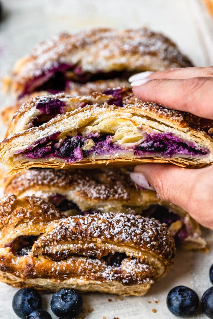 blueberry puff pastry slice with cream cheese filling.
