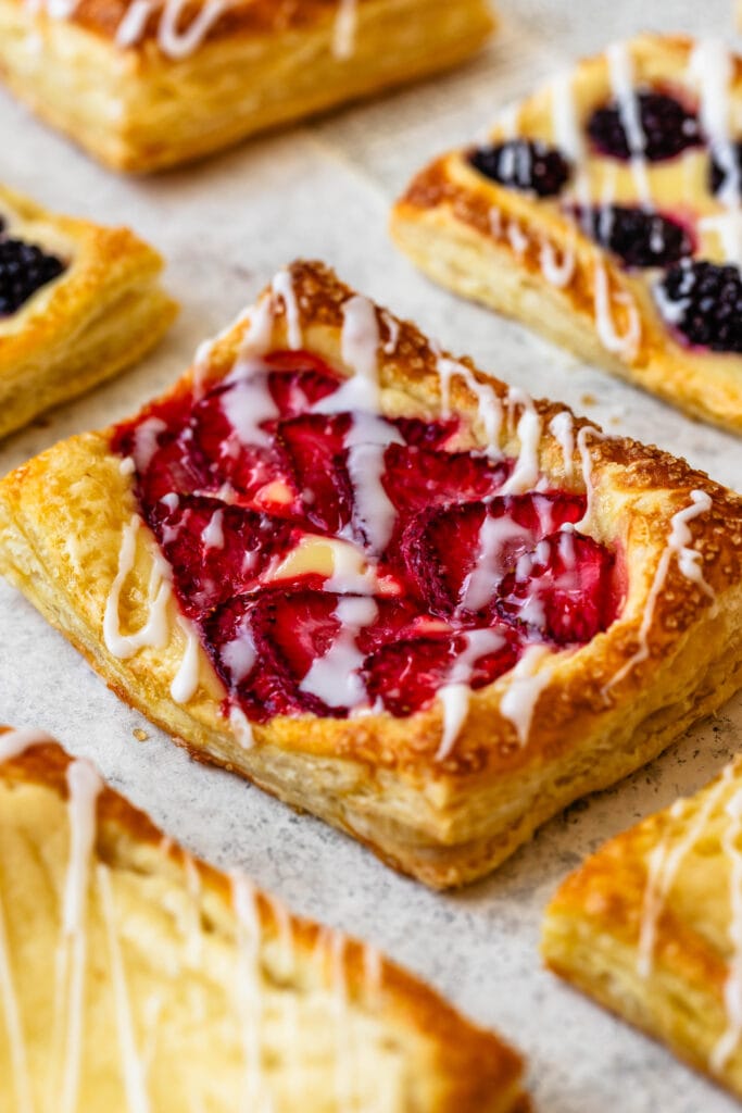 Puff Pastry topped with berries and cream cheese filling.