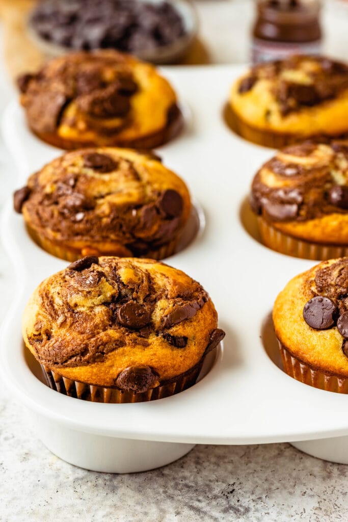 nutella muffins in a baking tin.